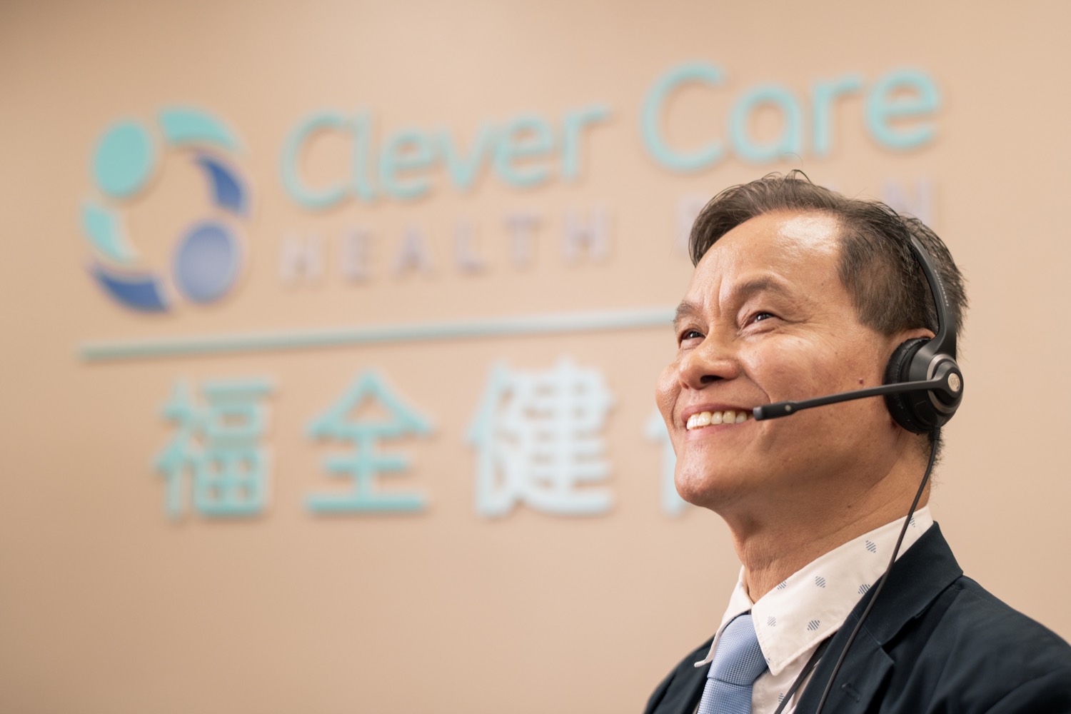 A Clever Care support specialist wearing a headset